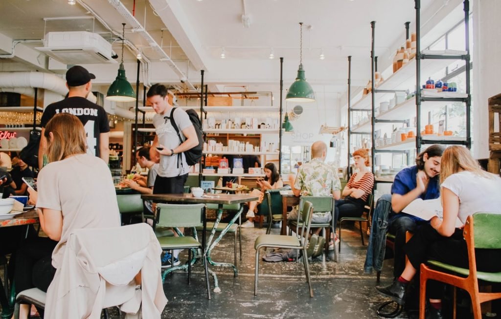 Young people at a busy coffee shop
