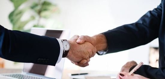 two businessmen shaking hands