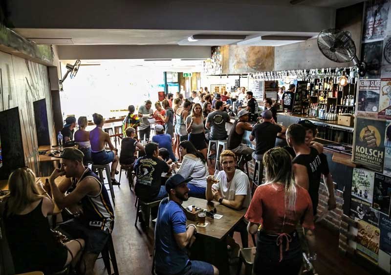 A crowded bar scene with people