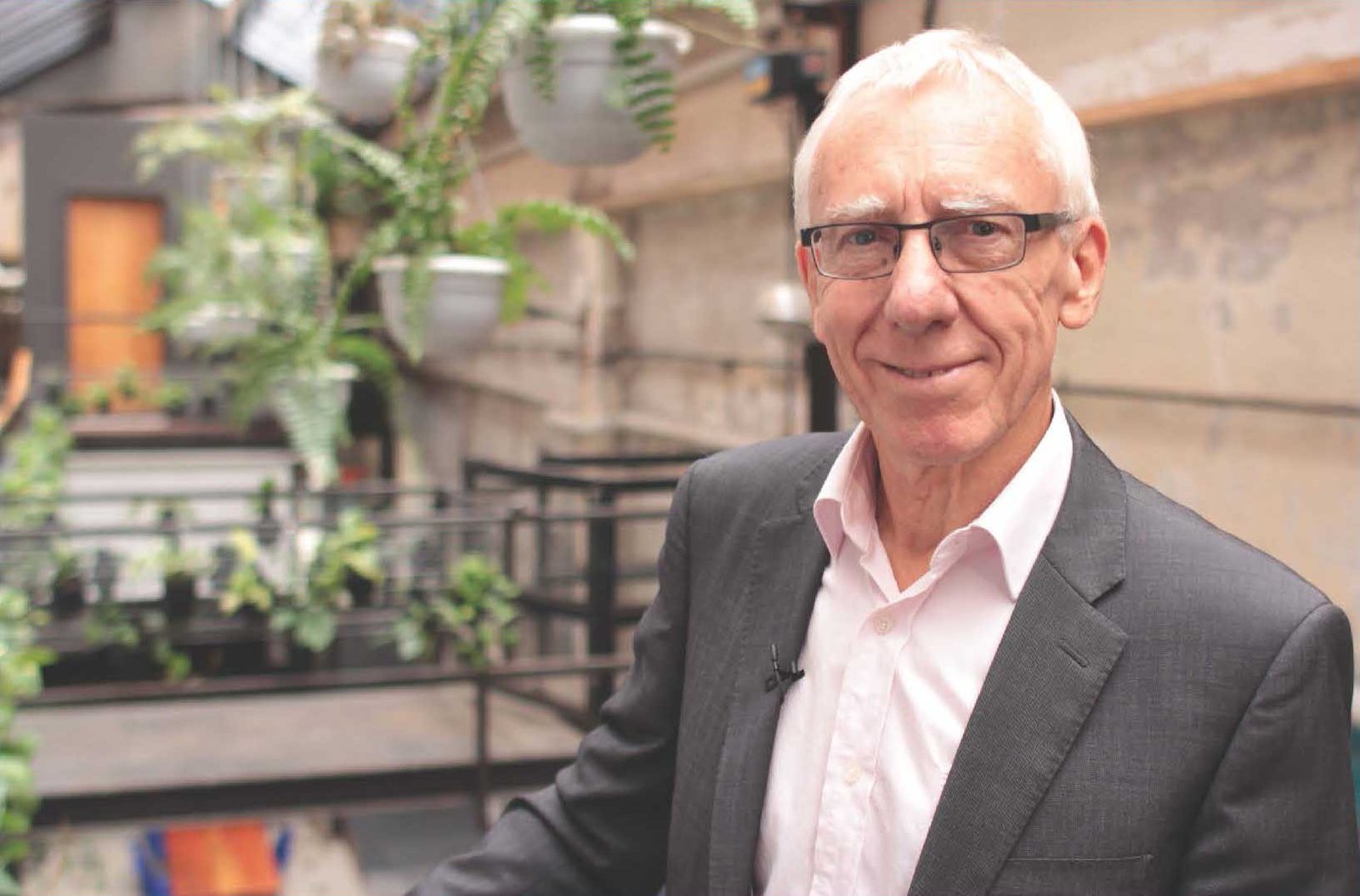 Brian Keen in a suit, smiling