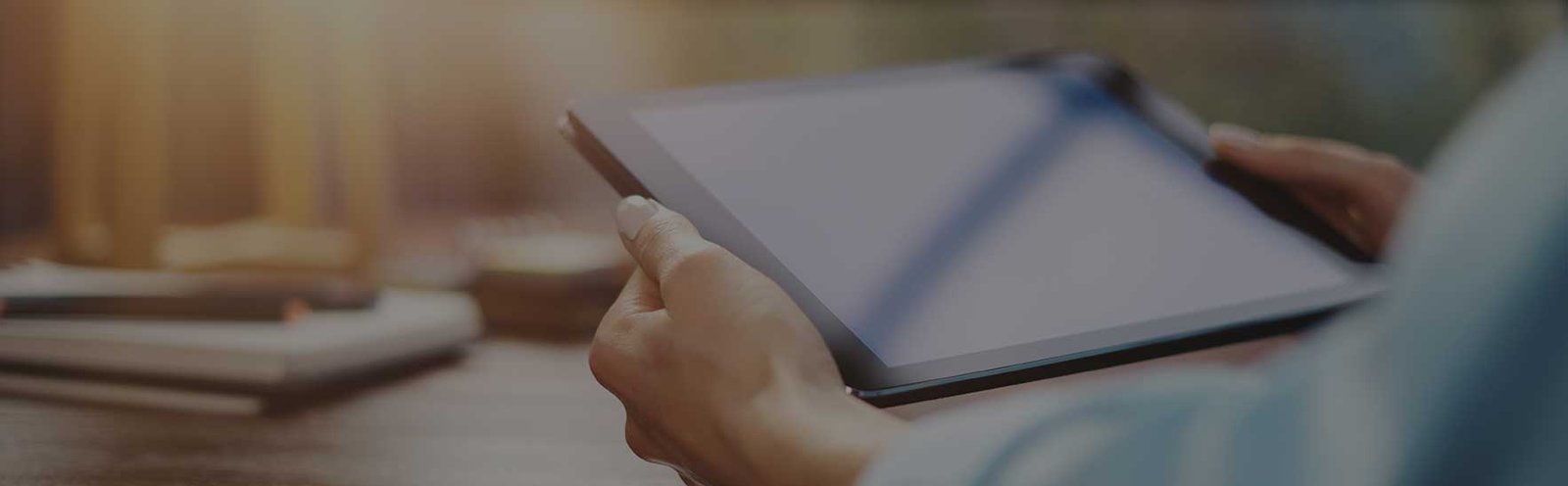 Person holding a tablet