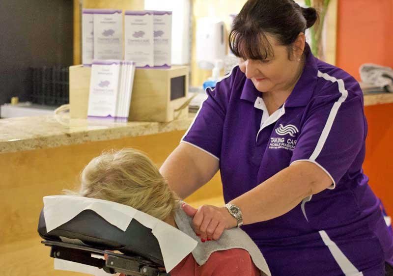 Focused woman providing a massage to a client